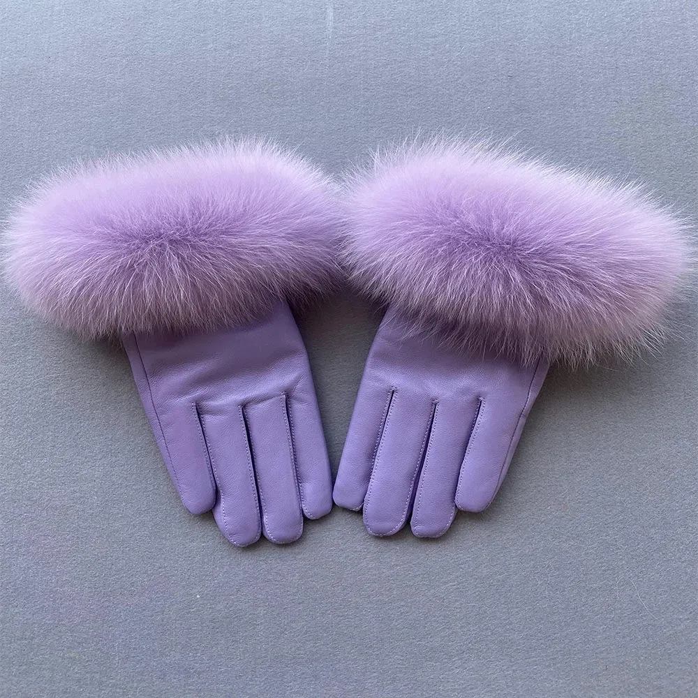 Gloves made of natural sheepskin with natural fur on a warm fluffy lining